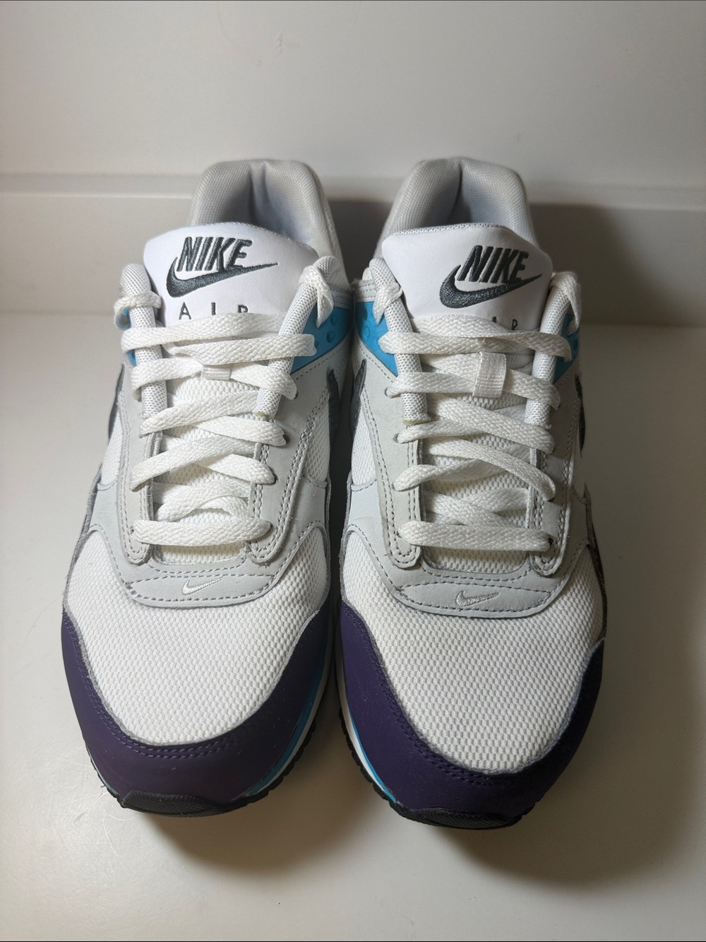 Nike Women’s White Air Sneakers with Purple and Teal Accents - Size 9.5